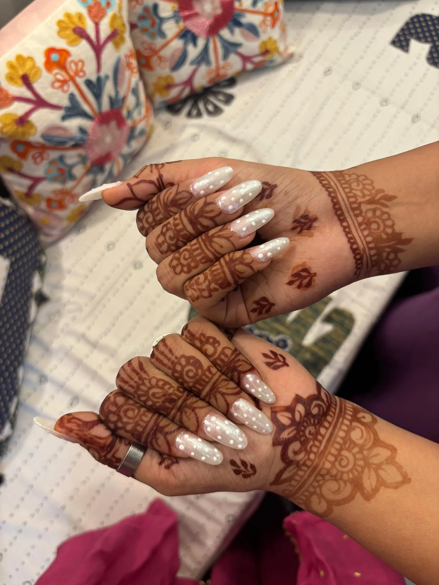 Long pearl-white nails with henna mehendi