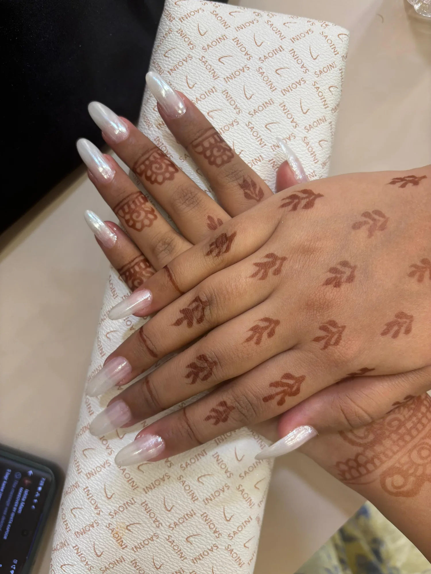 White French-tip nails with mehendi